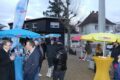 Zwischen Regenschirm und Rollator – Wahlkampf auf dem Wochenmarkt